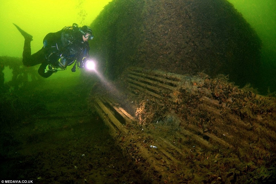 1411392467394_wps_58_A_bench_A_diver_examines_.jpg