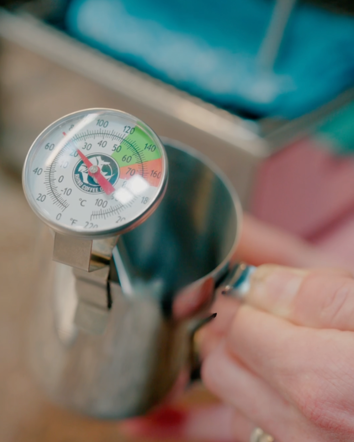 Barista steaming milk on an espresso machine at Black Market Training Sydney