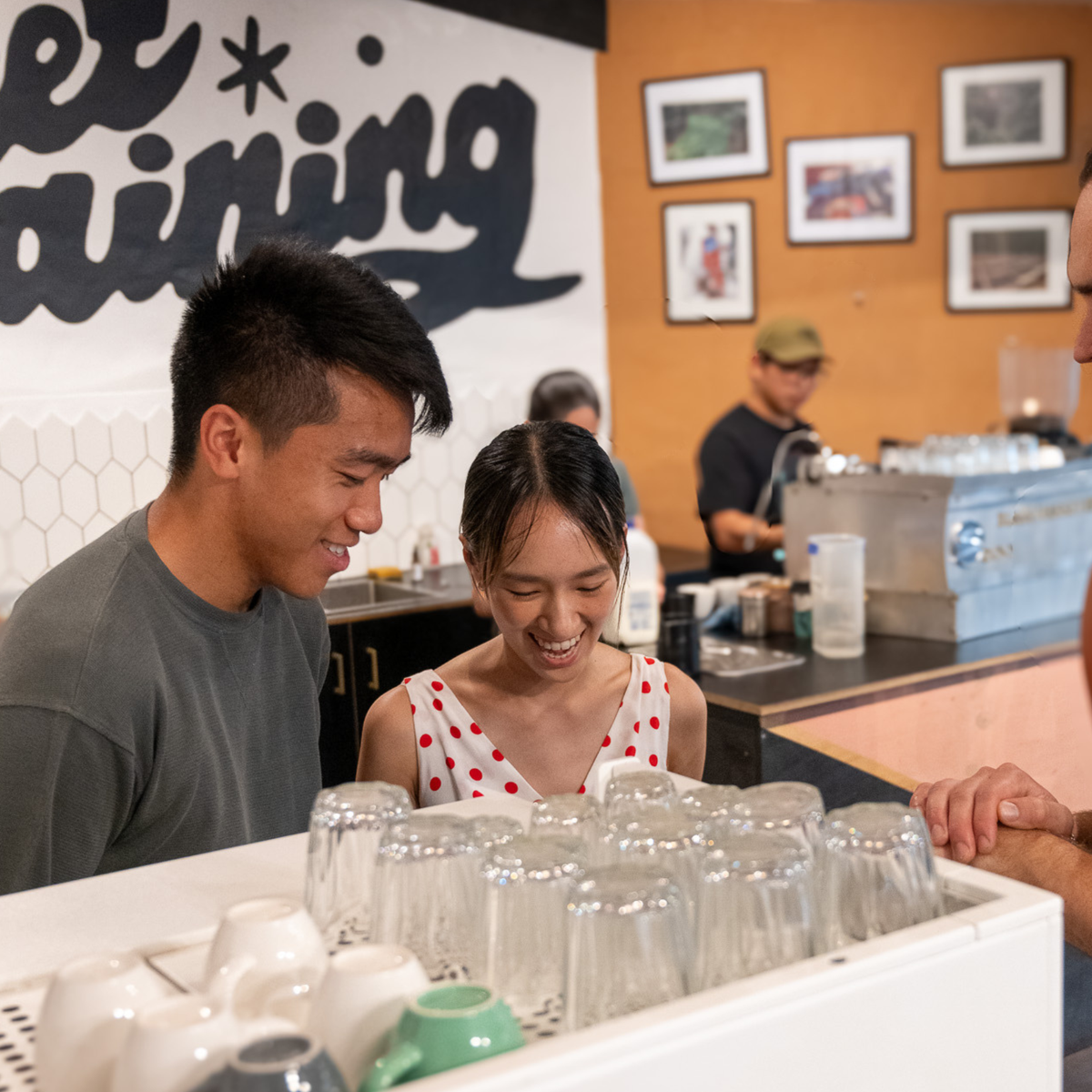 Team building activity in Sydney, students learning espresso skills together at Black Market Training Marrickville