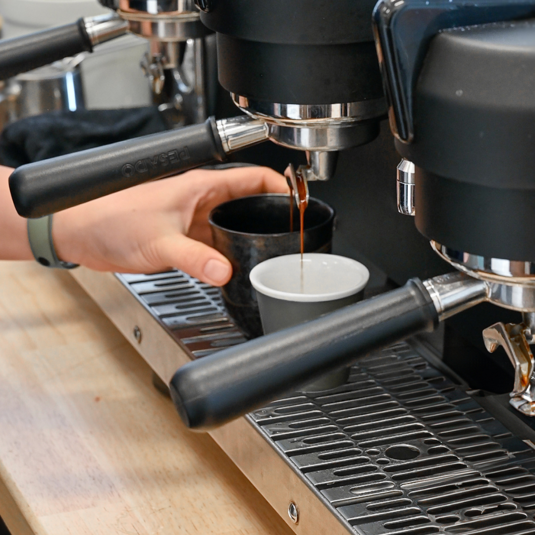 Espresso machine being used to make coffee 