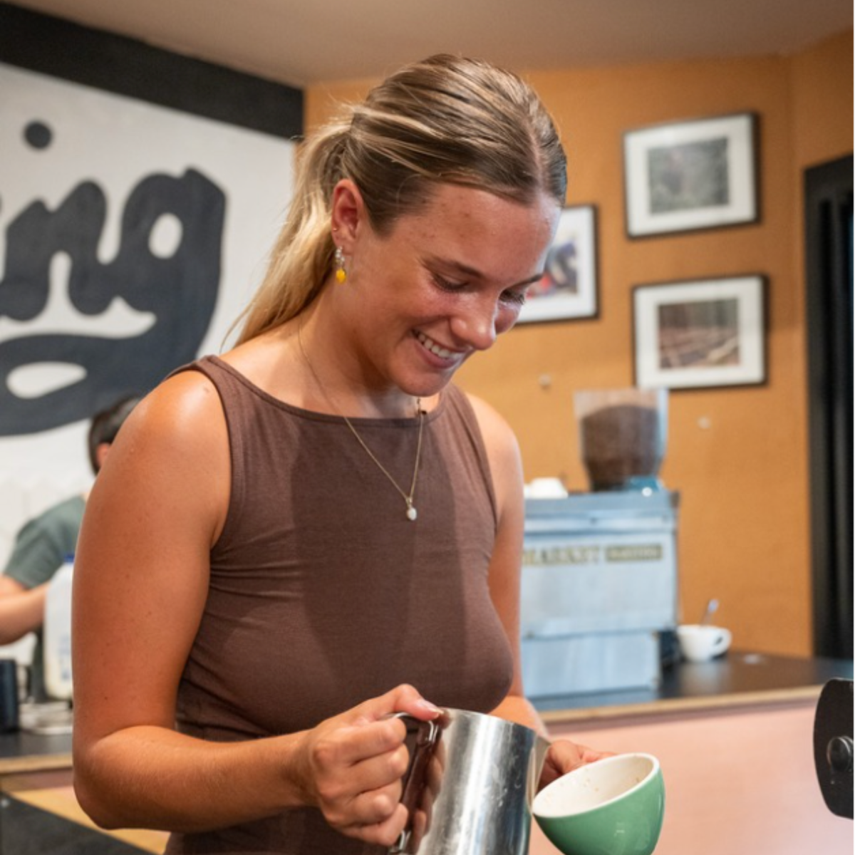 Happy students at Black Market café bootcamp learning barista skills Sydney